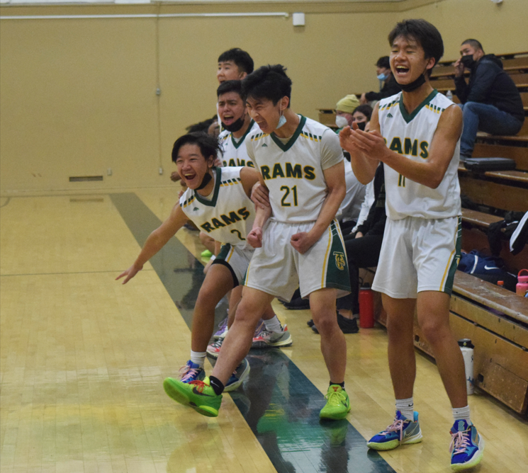 Boys basketball team claws past Wildcats